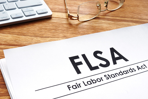 Fair labor standards act FLSA on a desk.