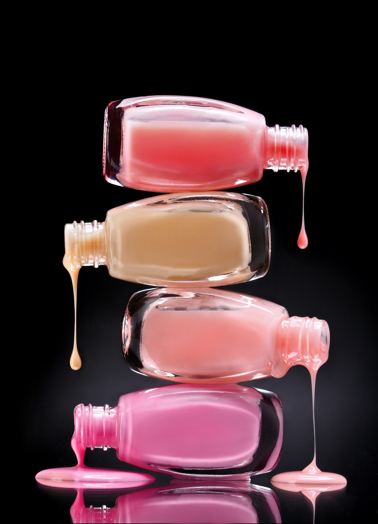 Nail polish dripping from open bottles